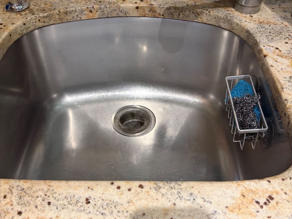 Kitchen sink, faucet, and counters finished by Diaz Cleaning